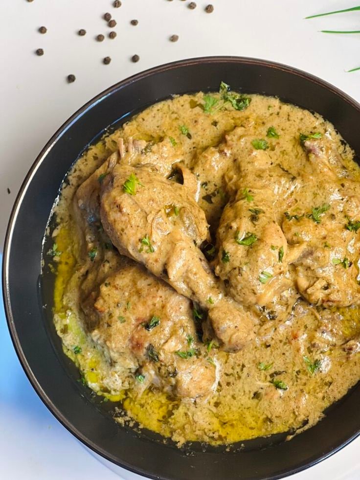 Creamy Afghani chicken pieces grilled and garnished with coriander